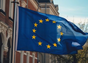 European Union Flag waving in front of building